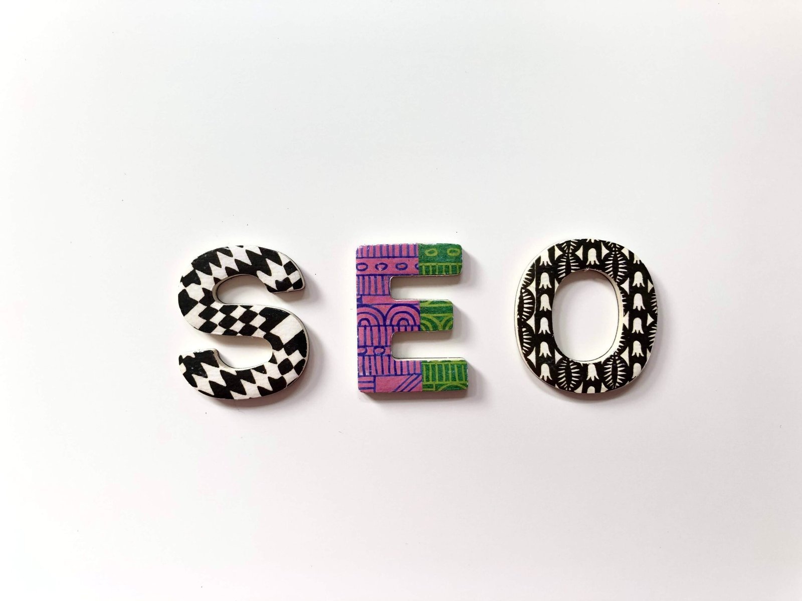 Colorful patterned letters spelling out "seo" against a white background, showcasing a lifestylealive vibe.